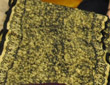 Yellow and black nuno-felted recycled silk scarf